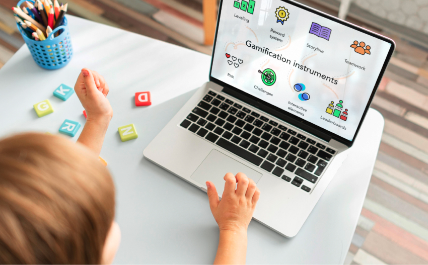 child using a gamification platform on a laptop